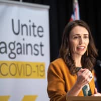 New Zealand Prime MinisterJacinda Ardern announces the removal of social distancing requirements, at Parliament in Wellington on Monday. | BLOOMBERG