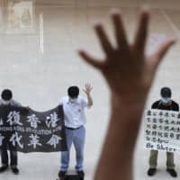 Demonstrators protest against China\'s national security legislation at a shopping mall in Hong Kong on May 29. | AP
