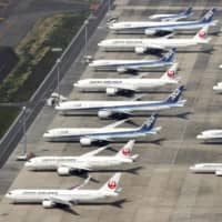 Aircraft are parked at Haneda Airport in Tokyo on April 30 amid the coronavirus epidemic. | KYODO