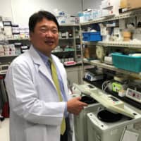 Ryuichi Morishita, a professor of clinical gene therapy at Osaka University, poses for a photograph during an interview at his laboratory in Osaka on Tuesday. | REUTERS