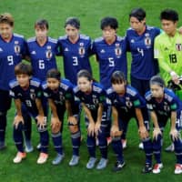 Nadeshiko Japan players pose for a team photo prior to their match against the Netherlands during the 2019 Women\'s World Cup in Rennes, France. | REUTERS