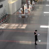 Haneda Airport in Tokyo is deserted in April amid coronavirus outbreak. | BLOOMBERG