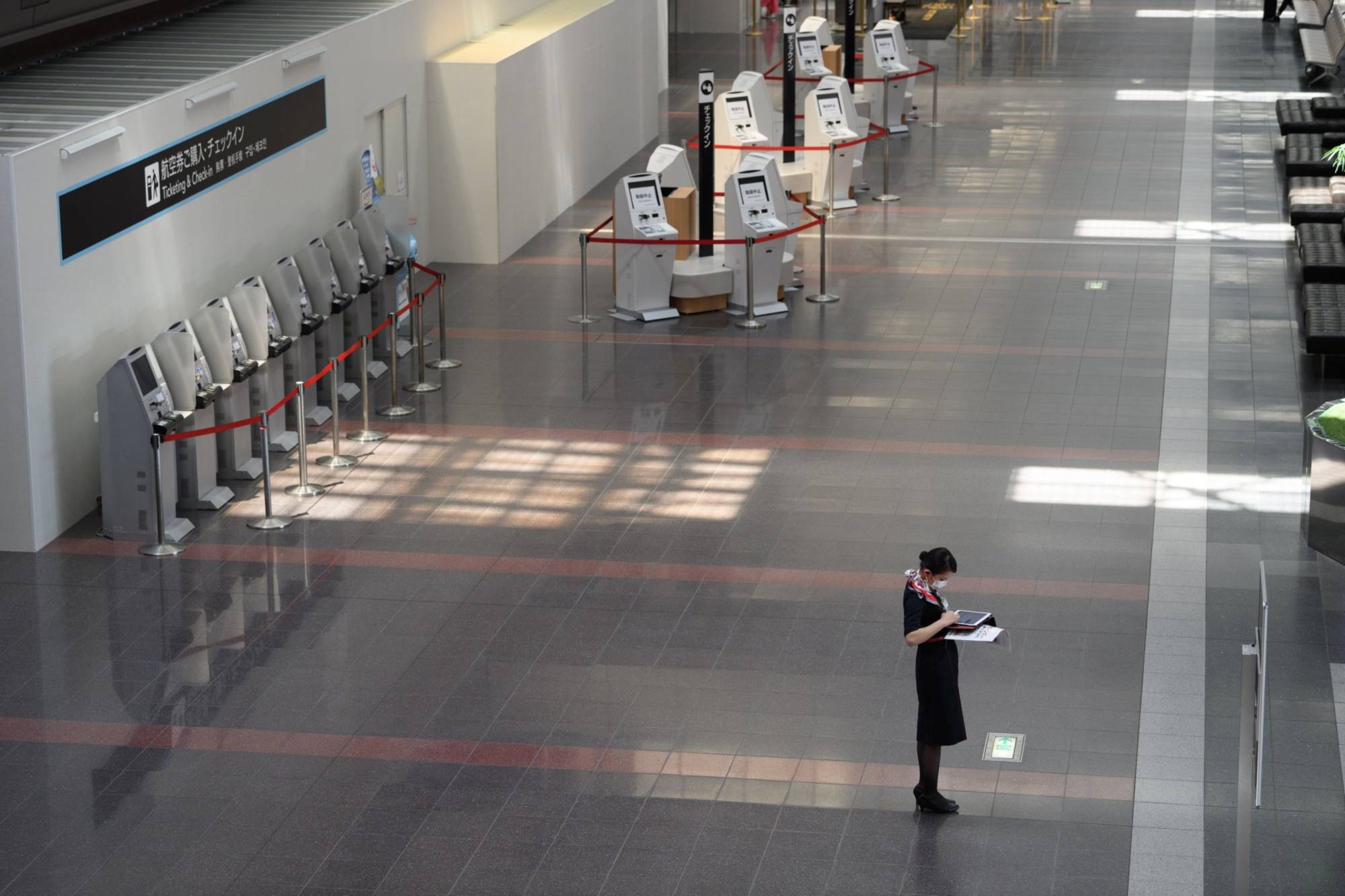 Haneda Airport in Tokyo is deserted in April amid coronavirus outbreak. | BLOOMBERG