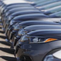 A long row of unsold cars are seen at a Honda dealership in Highlands Ranch, Colorado, on Sunday. | AP
