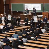 A standardized university entrance exam is held at the University of Tokyo campus in January. | KYODO