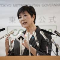 Tokyo Gov. Yuriko Koike attends a news conference on Friday at the Tokyo government office.  | RYUSEI TAKAHASHI 
