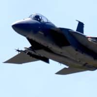 A U.S. Air Force F-15 fighter jet takes off from Lakenheath Air Base in 2005. | AFP-JIJI