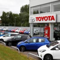 Cars are seen outside the Toyota car showroom in Stockport, Britain, on May 26. | REUTERS