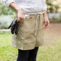 Workwear flair: Sanpu Sanyo’s Sanpu Maekake work aprons are made from durable sailcloth and accent panels with traditional designs. | YUDAI KUSANO
