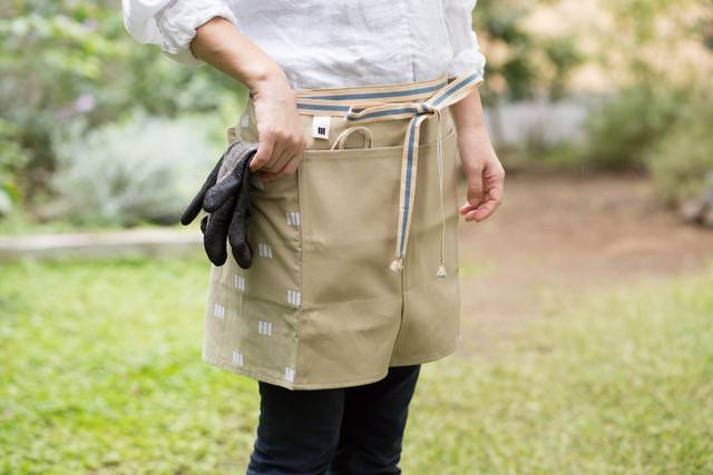 Workwear flair: Sanpu Sanyo’s Sanpu Maekake work aprons are made from durable sailcloth and accent panels with traditional designs.