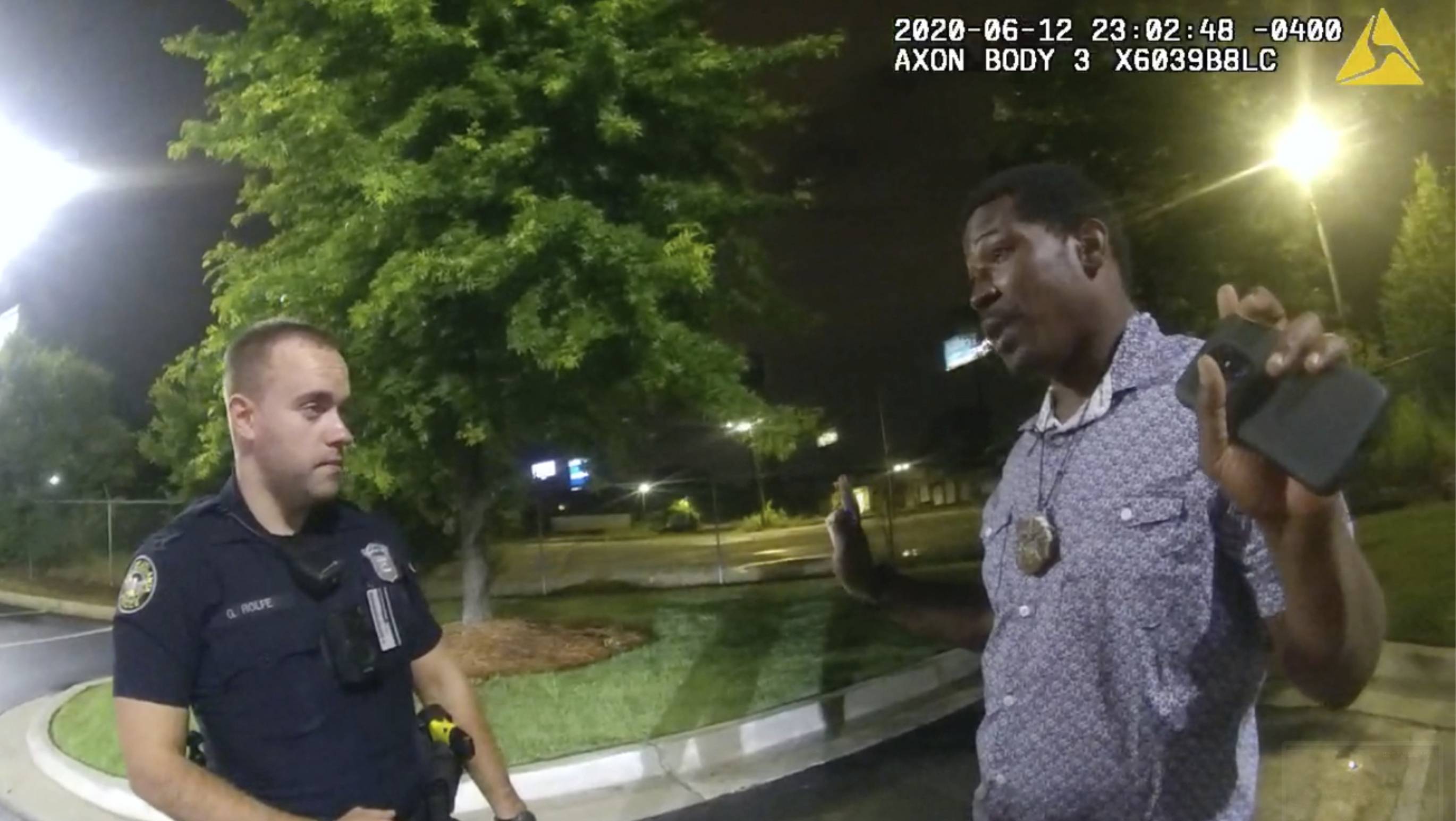 A screen grab taken from the body camera video provided by the Atlanta Police Department shows Rayshard Brooks speaking with officer Garrett Rolfe on Friday, the night Brooks was fatally shot. | Atlanta Police Department / via AP
