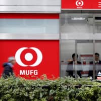 Tokyo-Mitsubishi UFJ and other banks are piling into risky debt to beat their lowly returns on interest rates in Japan. | REUTERS