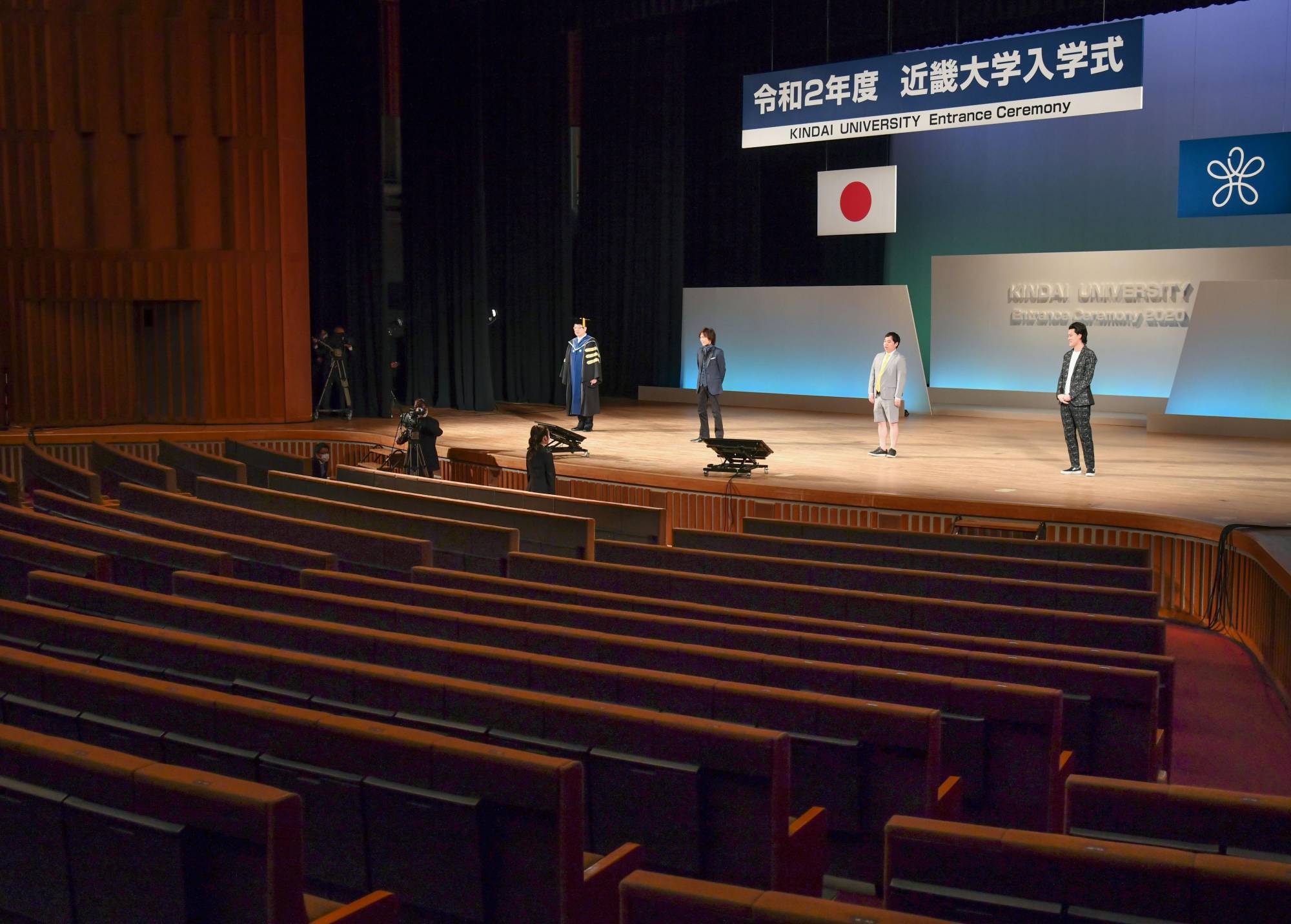 An entrance ceremony for Kindai University is held in Osaka on April 4 with no students present due to the spread of the new coronavirus. The students watched via YouTube. | KYODO