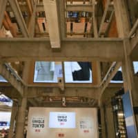 Uniqlo Co.\'s new flagship store features a multistory atrium that reveals a skeleton of exposed concrete beams and columns along with the various floors. | KYODO