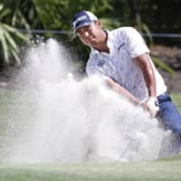 Hideki Matsuyama hits out of a bunker on the 12th hole during the first round of the RBC Heritage golf tournament in Hilton Head, South Carolina, on Thursday. | USA TODAY / VIA REUTERS