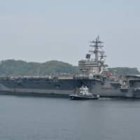 The USS Ronald Reagan returns to its berth in Yokosuka, Kanagawa Prefecture in July 2018. Japan is home to strategic U.S. forces that are responsible not just for Japan’s defense, but for regional security and defense of U.S. interests. | U.S. NAVY