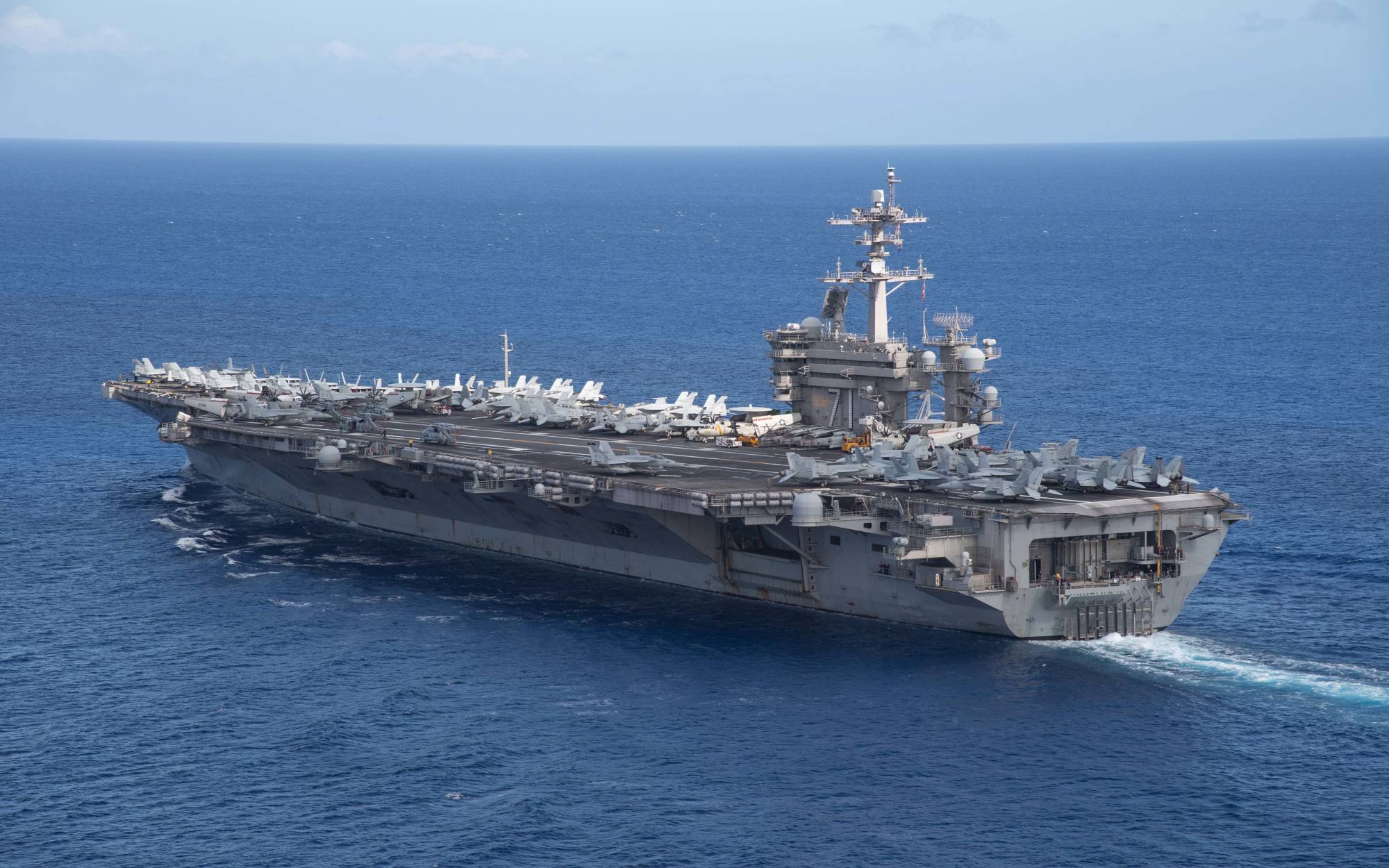 The aircraft carrier USS Theodore Roosevelt operates in the Philippine Sea on May 21, following an extended visit to Guam in the midst of the coronavirus pandemic. | U.S. NAVY