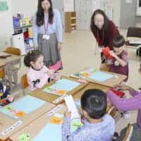 Children of foreign nationalities learn Japanese in Kani, Gifu Prefecture, in February. | KYODO