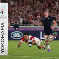 Japan\'s Kenki Fukuoka scores a try against Scotland during the Rugby World Cup on Oct. 13 in Yokohama. | REUTERS