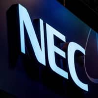 Nippon Telegraph and Telephone Corp. is planning to invest in NEC Corp. to jointly develop 5G wireless network technology. | GETTY IMAGES / VIA KYODO
