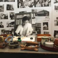 Former Naha Mayor Kamejiro Senaga, a major political figure during the American Occupation of Okinawa, is shown working in a display at the Kamejiro Senaga and the People’s History Museum in Naha. | ROBERT D. ELDRIDGE
