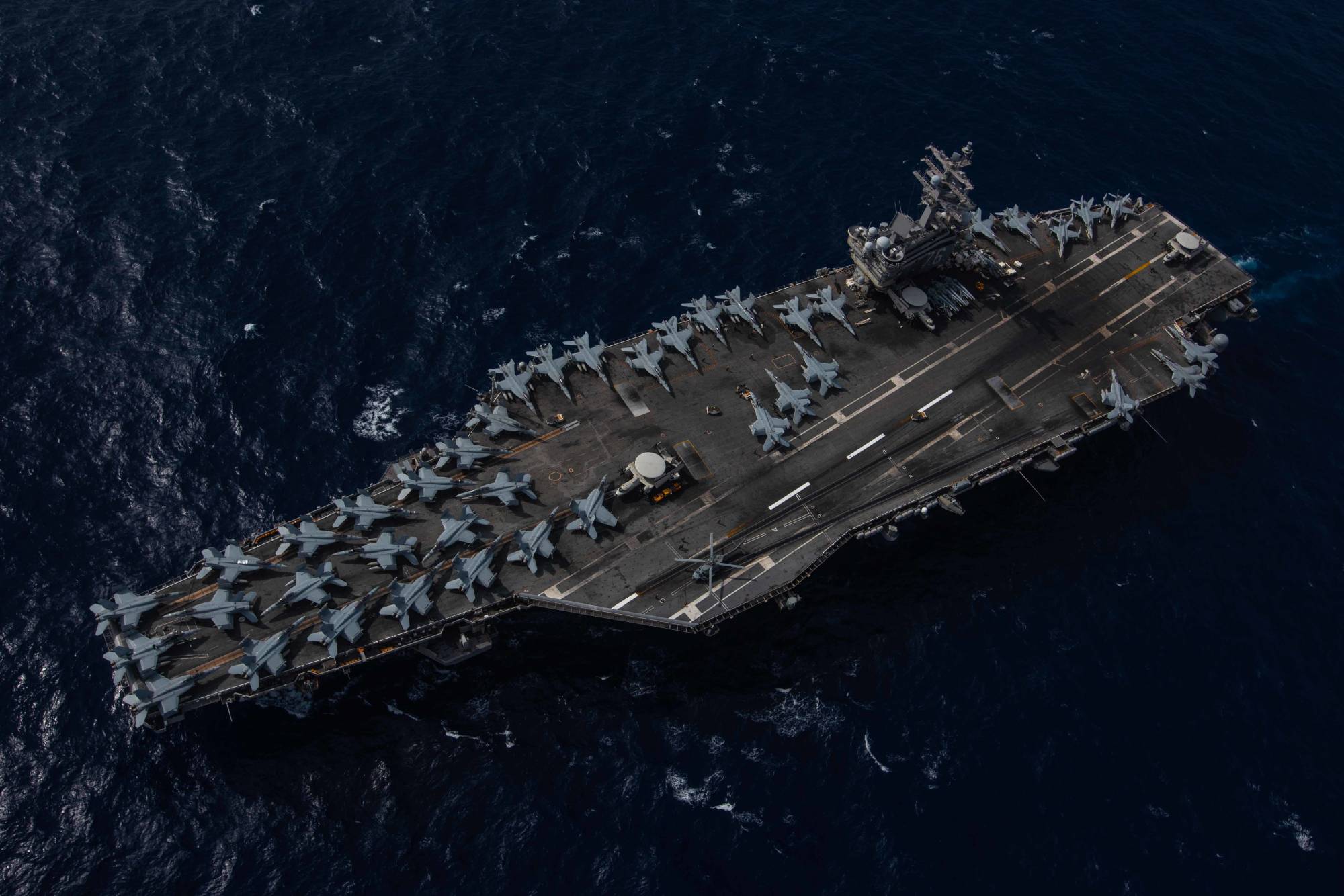 The USS Ronald Reagan aircraft carrier sails in the Philippine Sea in August last year. | U.S. NAVY