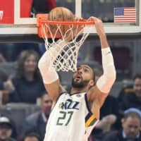 Jazz center Rudy Gobert dunks during a game against the Cavaliers on March 2 in Cleveland.  | USA TODAY / VIA REUTERS