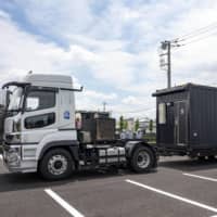 A mobile container hotel is shipped to the city of Mitaka in Tokyo. | DEVELOP CO. / VIA KYODO