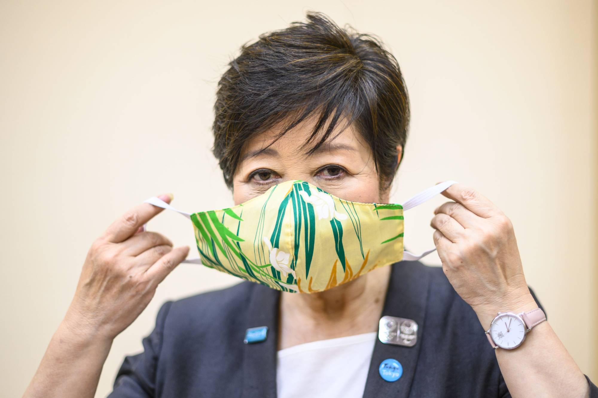 Tokyo Gov. Yuriko Koike has announced a revised set of guidelines that will shift the emphasis to the city’s health care system and whether hospitals are capable of accepting more patients. | AFP-JIJI