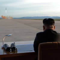 North Korean leader Kim Jong Un watches the launch of a Hwasong-12 intermediate-range ballistic missile in this photo released in September 2017. Nuclear-armed Pyongyang could be weighing a summit — or provocation — ahead of November\'s U.S. presidential election, experts say. | KCNA / VIA REUTERS