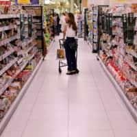 Supermarket operator Aeon Co. has seen a rise in shoppers turning to the internet for supplies as a result of the pandemic. | REUTERS