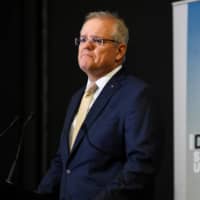 Australian Prime Minister Scott Morrison announces new defense spending on Wednesday in Canberra. | AAP / VIA REUTERS 