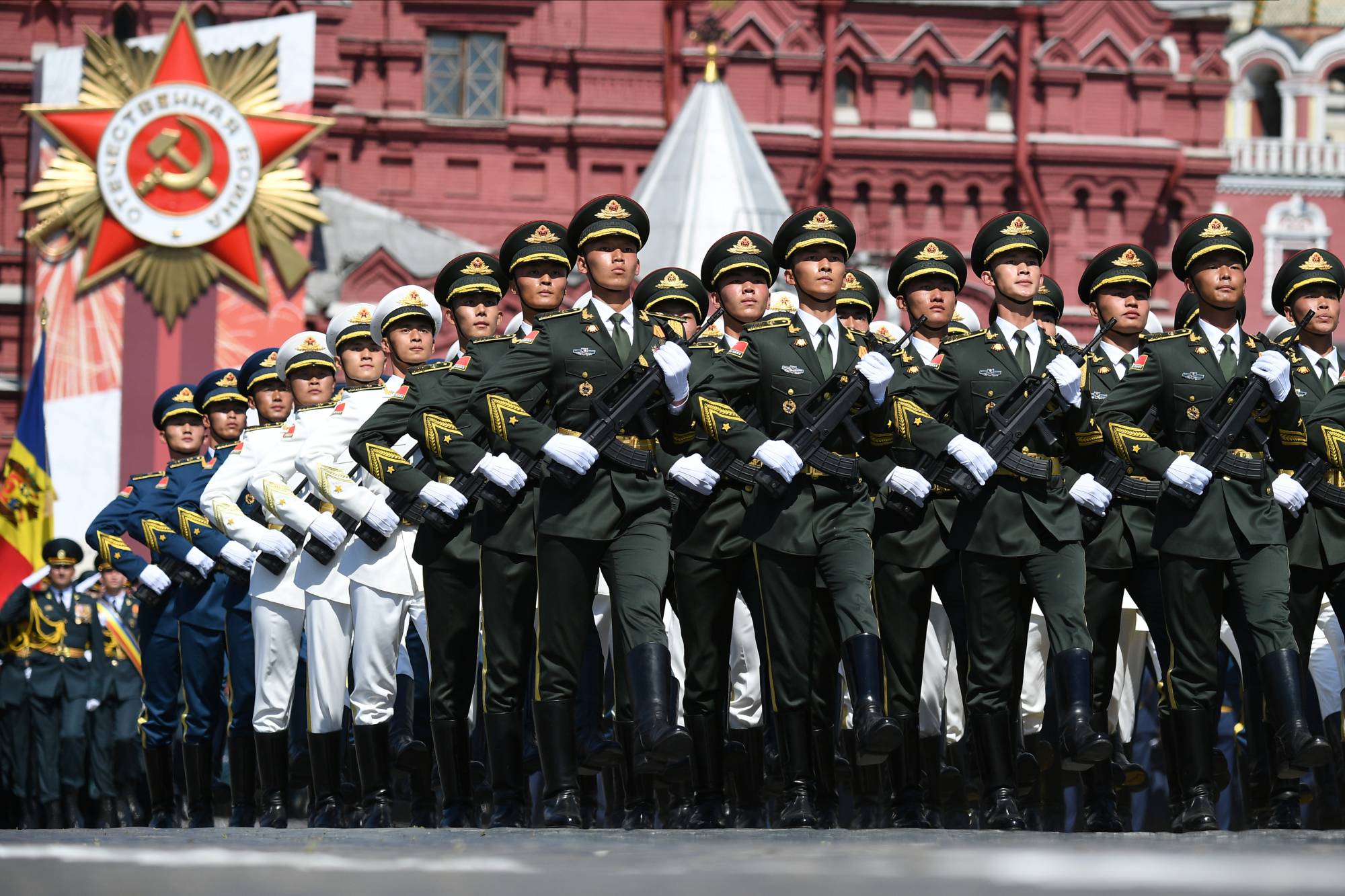 Soldiers of the China's People's Liberation Army march during the Victory Day Parade in Moscow on June 24. | Pool / via REUTERS