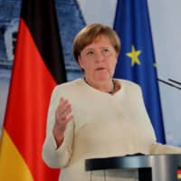 \"We’re aware that Germany’s presidency comes with great expectations,” Angela Merkel said in a weekly podcast Saturday. | POOL / VIA REUTERS