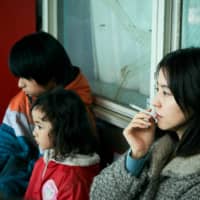 Tainted love: Masami Nagasawa plays a wild and abusive single parent who torments her son in “Mother.” | ©2020 “MOTHER” FILM PARTNERS