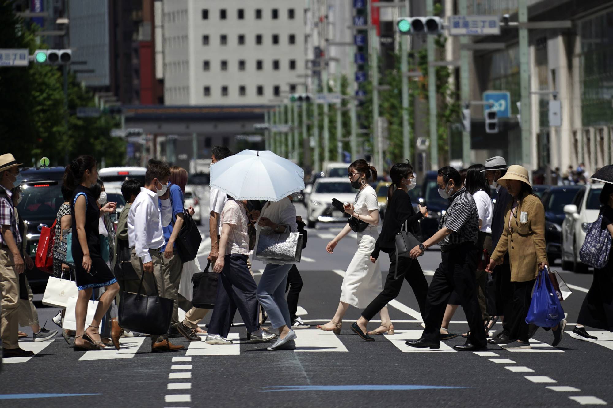 Tokyo reported 107 coronavirus cases Thursday, the highest the capital has seen since May 2. | AP