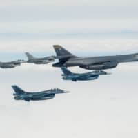 Air Self-Defense Force F-2s conduct bilateral joint training with a U.S. Air Force B-1B Lancer and U.S. F-16 Fighting Falcons off the coast of northern Japan on April 22. | U.S. AIR FORCE