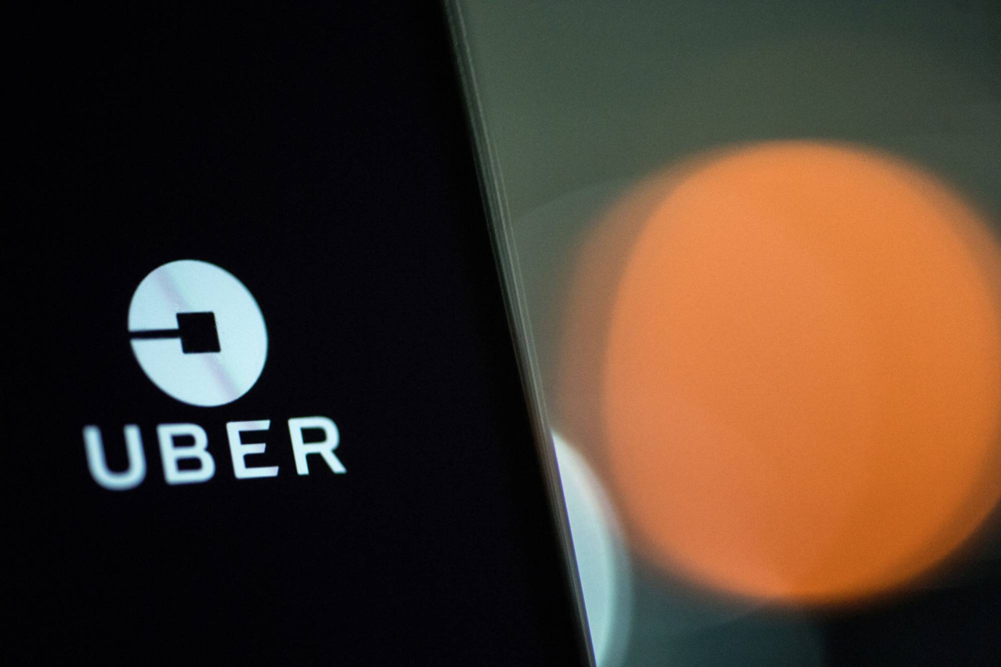 Starting Friday, users in Tokyo can hail taxis using the Uber app. | BLOOMBERG