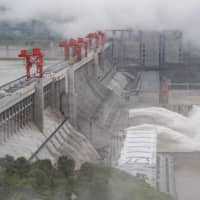 China’s hydro industry, which includes the massive Three Gorges Dam, is downshifting toward smaller projects and pumped storage. Engineers have run out of the easiest locations to power massive sets of turbines and the falling costs of rival energy sources such as solar mean it isn’t worth moving on to more challenging locations. | AFP-JIJI