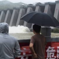 As China emerged onto the global scene in the late 1990s, so too did its dam-building industry. | XINHUA / VIA AP