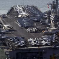 Two U.S. aircraft carriers, including the USS Nimitz, entered the flashpoint South China Sea for joint operations on Saturday. | AP