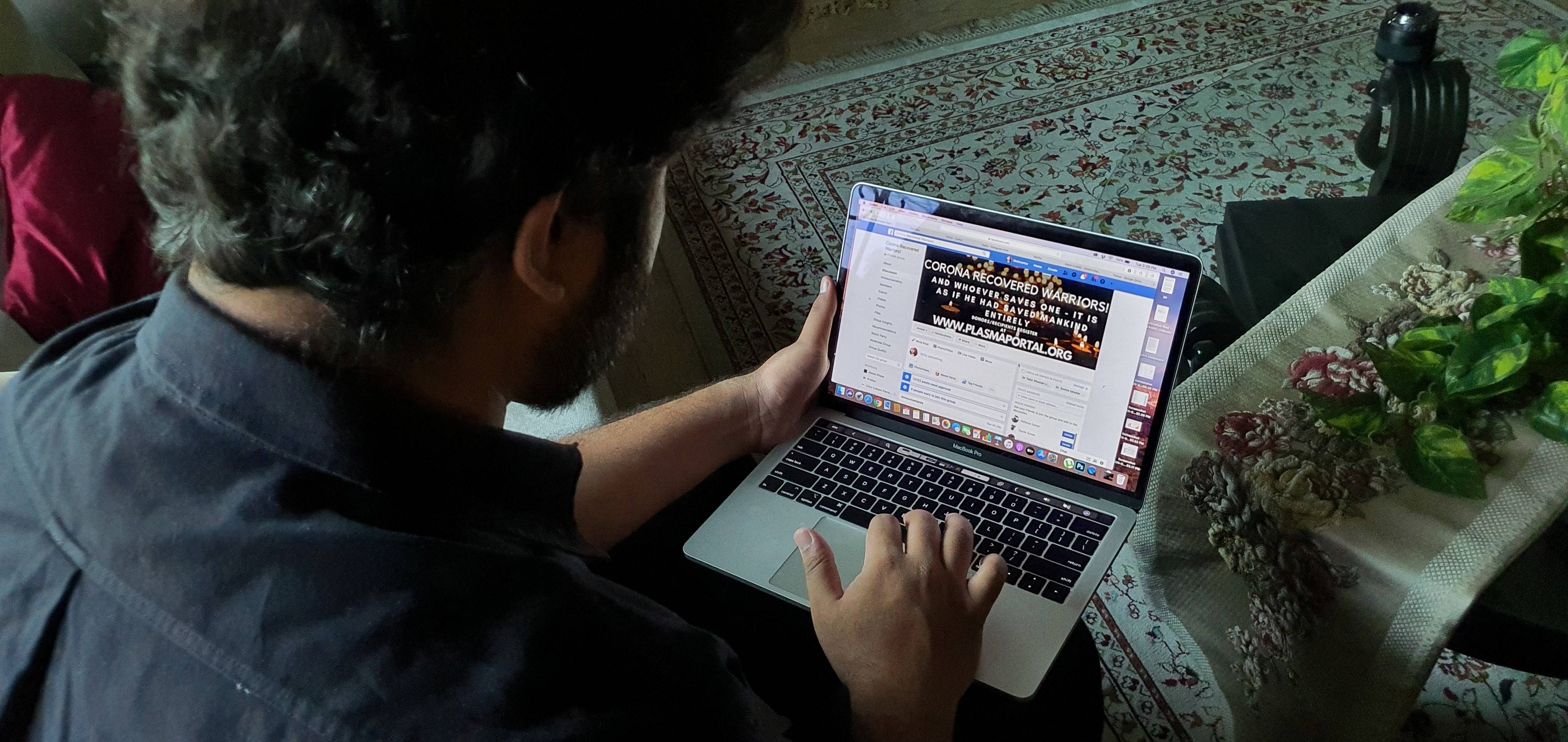 A Facebook employee works on a computer at his residence in Lahore, Pakistana, on June 30. Facebook, which employs about 4,000 people in the U.K., could have half of its employees working remotely over the next five to 10 years, CEO Mark Zuckerberg said in May. | ZORAIZ RIAZ / VIA REUTERS