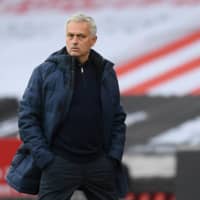 Tottenham manager Jose Mourinho watches his team\'s Premier League match against Sheffield United on Saturday in Sheffield, England. | REUTERS
