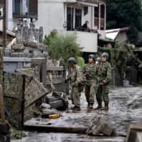 Self-Defense Forces personnel conduct rounds to check on residents\' safety in Hitoyoshi, Kumamoto Prefecture, on Saturday afternoon. | KYODO