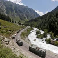 An Indian Army convoy moves along a highway leading to Ladakh, in Kashmir\'s Ganderbal district, on June 18. | REUTERS 