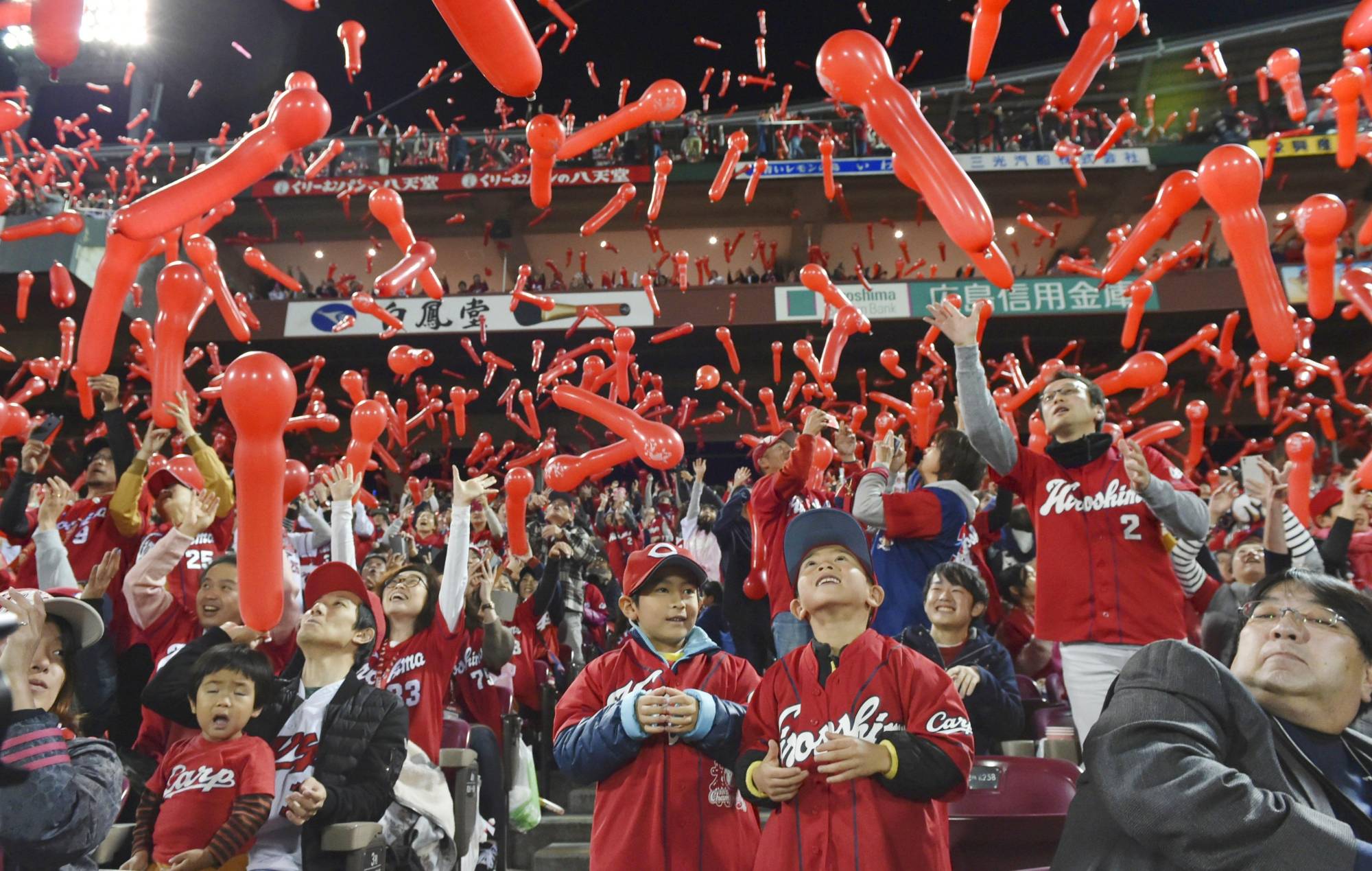 Carp fans release balloons during the seventh inning in Game 2 of the Japan Series at Mazda Stadium in Hiroshima on Oct. 28, 2018. | KYODO