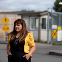 Sandra Videla, whose Guatemalan husband, Timoteo Vicente-Chun, is detained at the Northwest ICE Processing Center, poses outside the facility in Tacoma, Washington. | REUTERS 