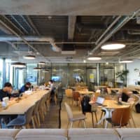 People study in a common area of a student-accommodation facility run by GSA Star Asia KK in Tokyo\'s Hakusan area in January. | KAZUAKI NAGATA 