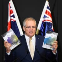 Australia\'s Prime Minister Scott Morrison speaks during the launch of the 2020 DefenceStrategic Update at the Australian Defence Force Academy in Canberra on July 1. |  AAP IMAGE / LUKAS COCH / VIA REUTERS