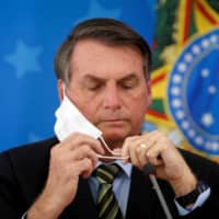 Brazilian President Jair Bolsonaro has pushed his government to make hydroxychloroquine widely available and encouraged Brazilians to take it. | REUTERS 